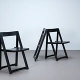 Set of three black folding chairs circa 1980