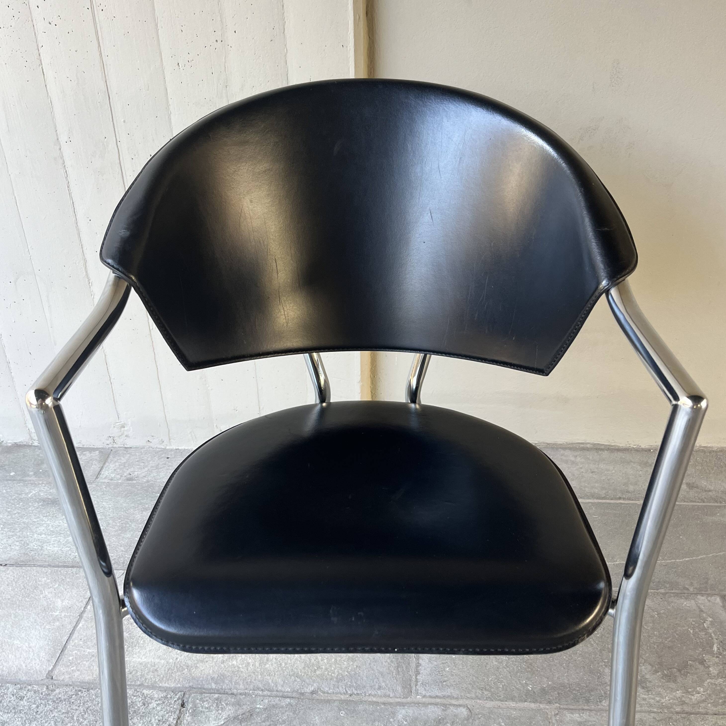 Set of four Italian black leather chairs, 1970