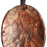 African wooden mask, face topped with a bird.