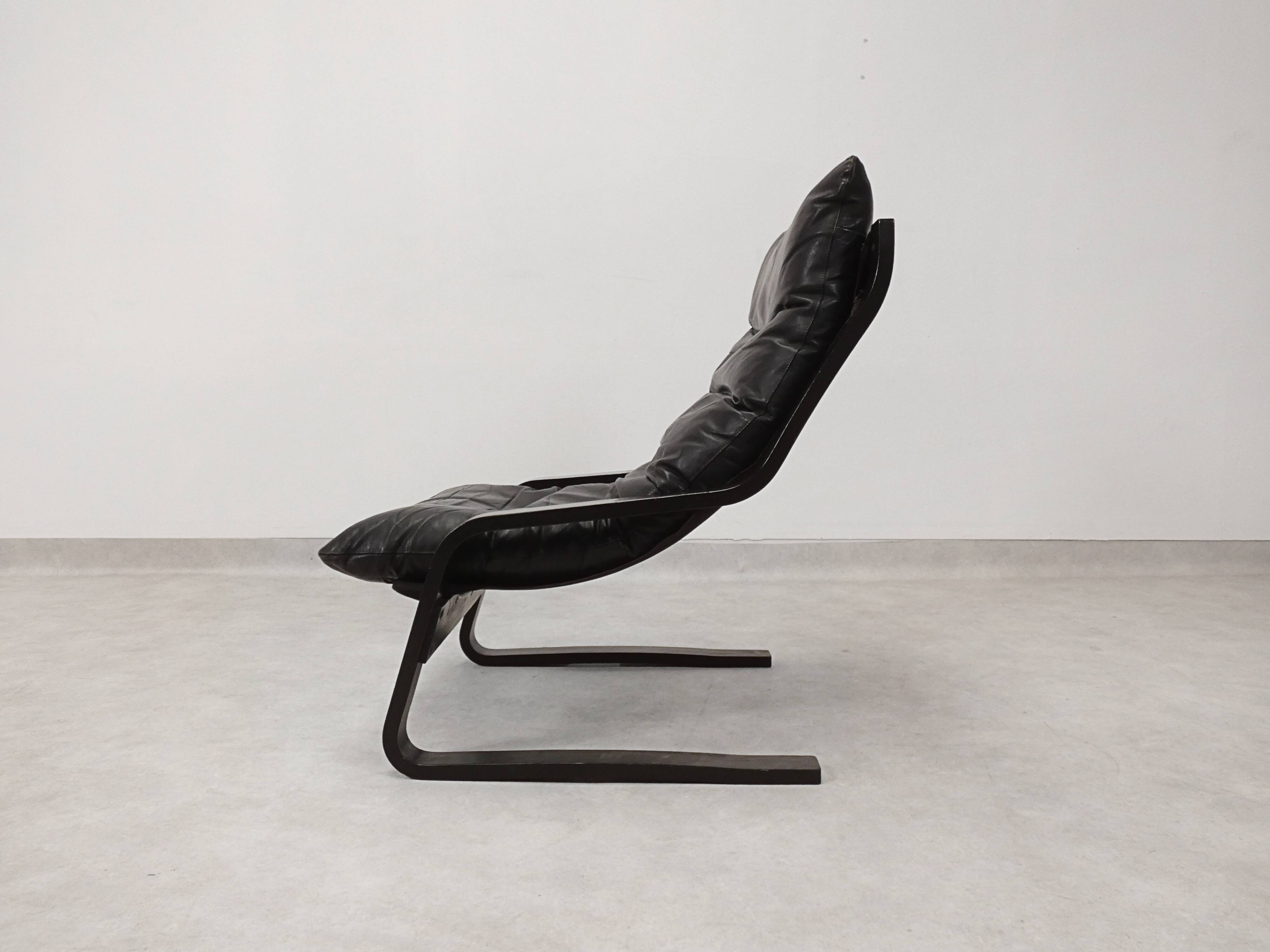 high-back scandianavian lounge chair in leather