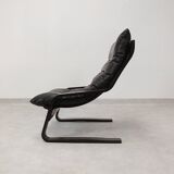 high-back scandianavian lounge chair in leather