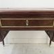 Louis XVI style desk in mahogany and mahogany veneer, 20th century.