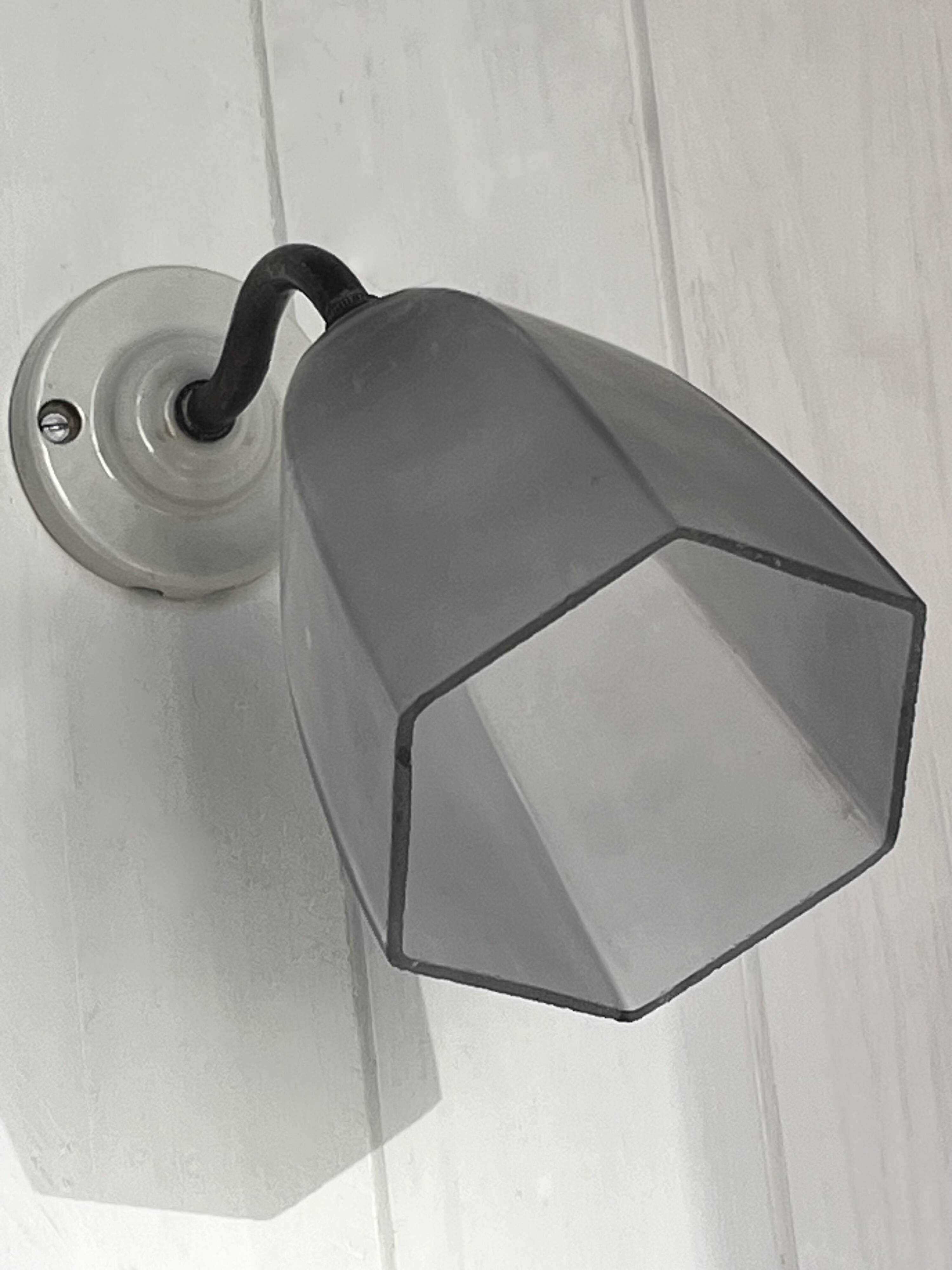 Swan neck wall light on porcelain base