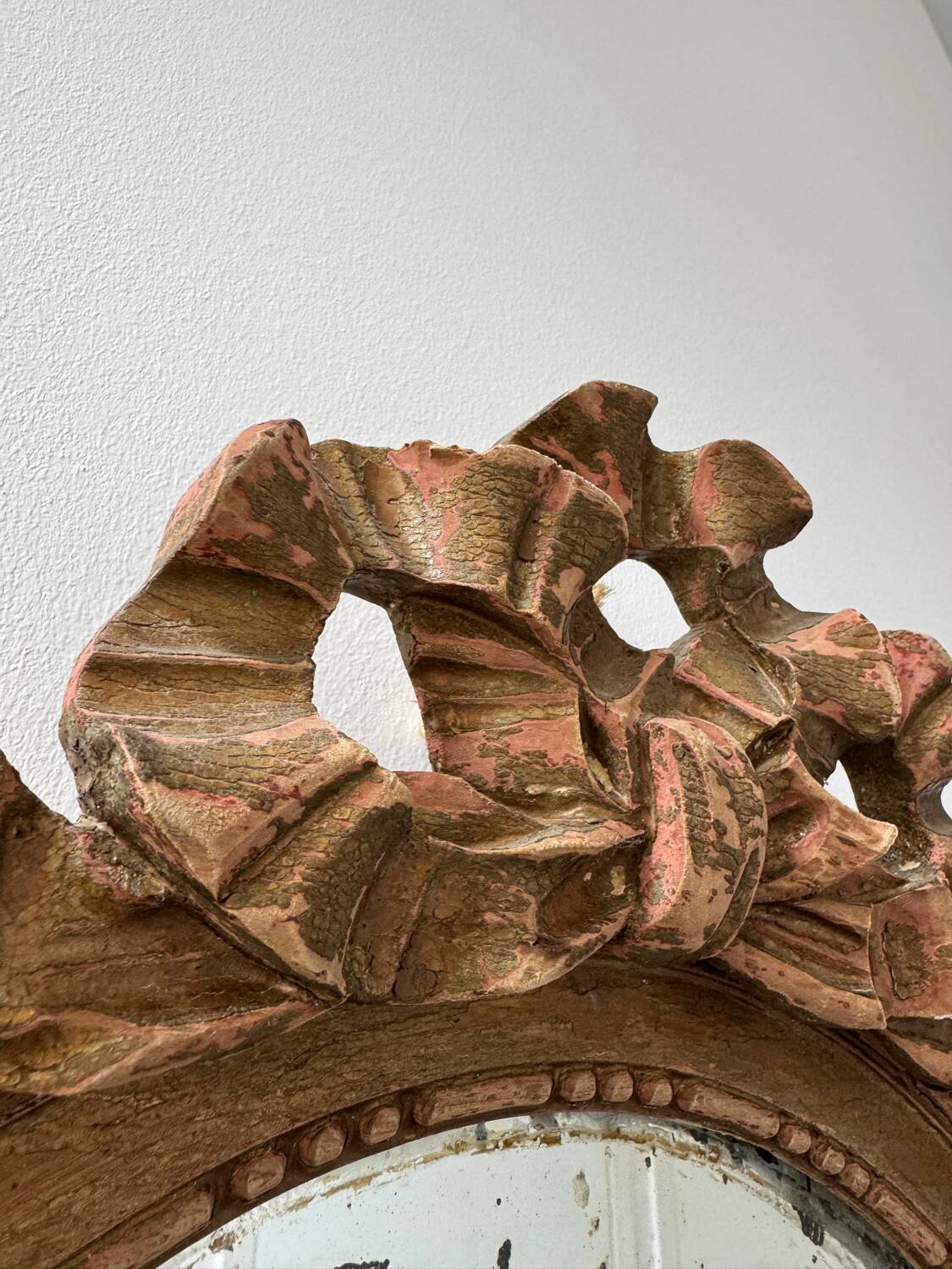 Antique Louis XVI oval knot mirror