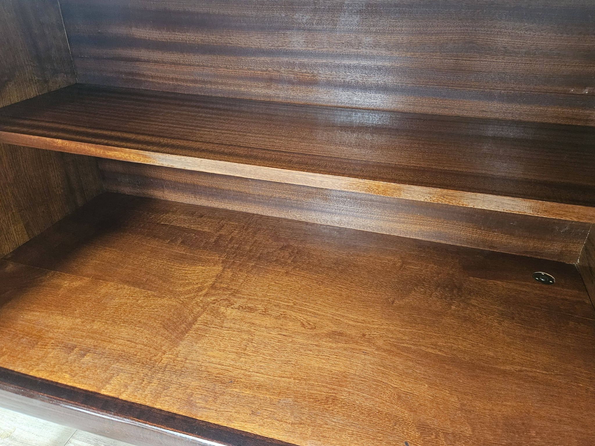 Mid-century mahogany buffet with teal glass and compartments with a drawer.