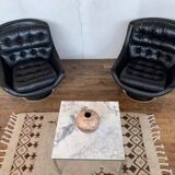 Paire de fauteuils vintage pivotants en cuir noir pied tulipe