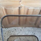 Folded chair by Giancardo Piretti for Castelli