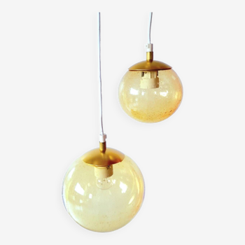 Set of 2 bubbled amber glass globe pendants
