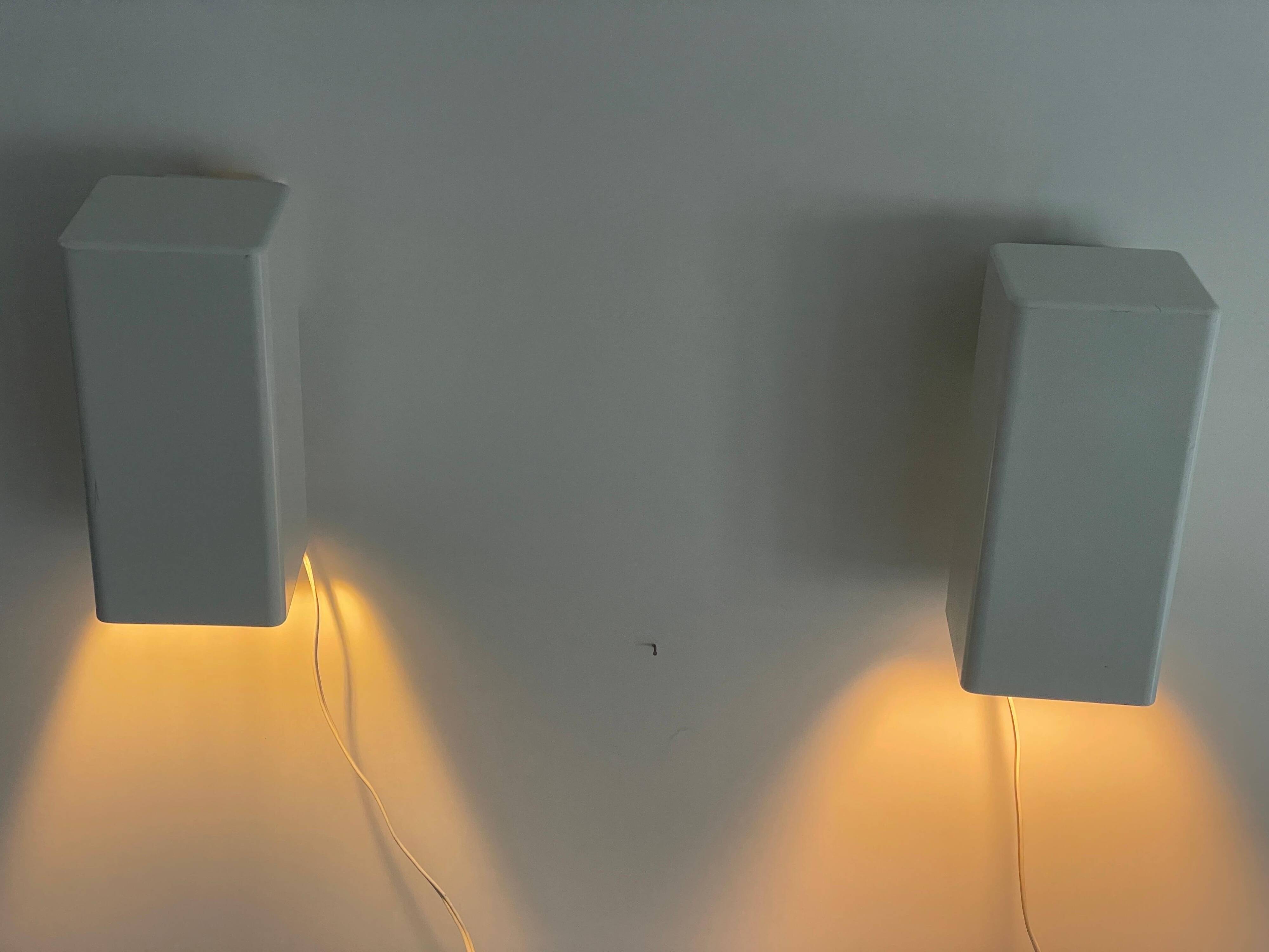 Pair of minimalist white metal wall lights from the mid-century, 1960, Germany.