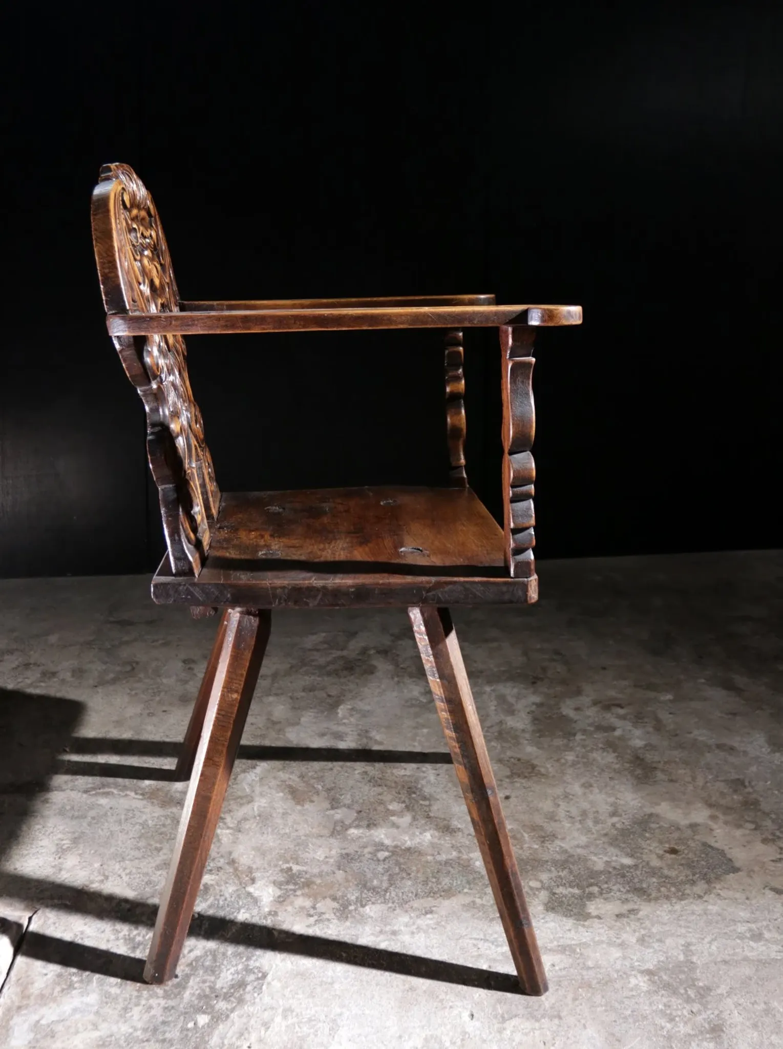 17th century Alpine carved walnut Brettstuhl armchair with grotesque mask
