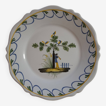 Earthenware plate with bird flute player decoration