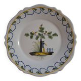 Earthenware plate with bird flute player decoration