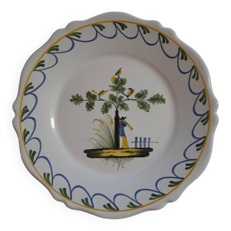 Earthenware plate with bird flute player decoration