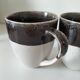 Set of three two-tone mugs, glazed stoneware, café workshop style.