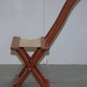 Antique Chinese folding chair with carvings, circa 1900-1920.