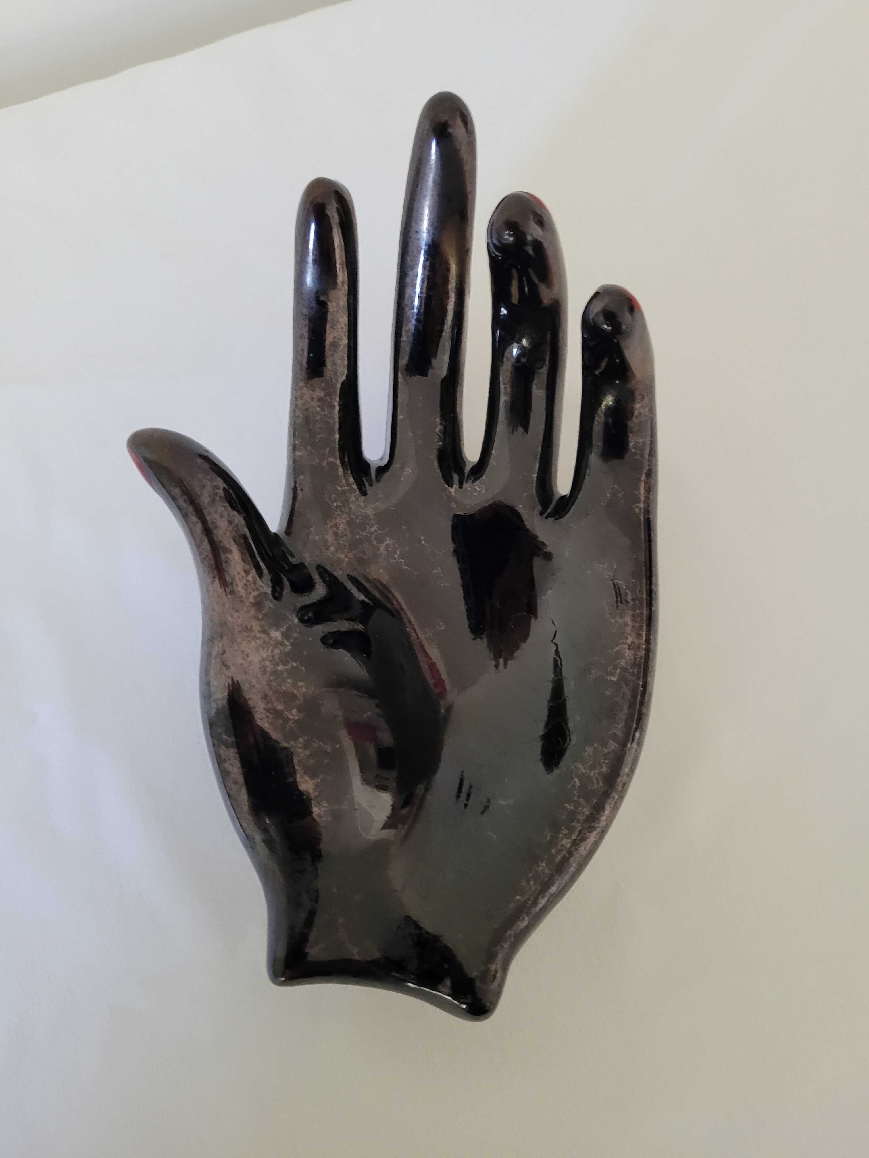 Empty pockets in the shape of a hand