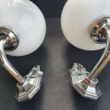 Pair of chrome wall sconces for bathroom with vintage fish pattern.
