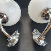 Pair of chrome wall sconces for bathroom with vintage fish pattern.