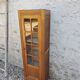 Showcase an old door, small bookshelf.