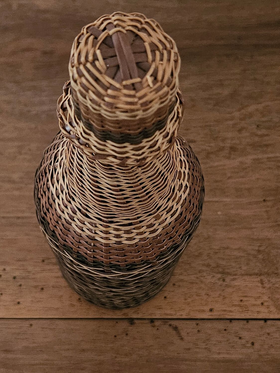 Glass and rattan bottle