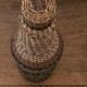 Glass and rattan bottle