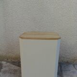 Beige vintage side tables, wooden tops.