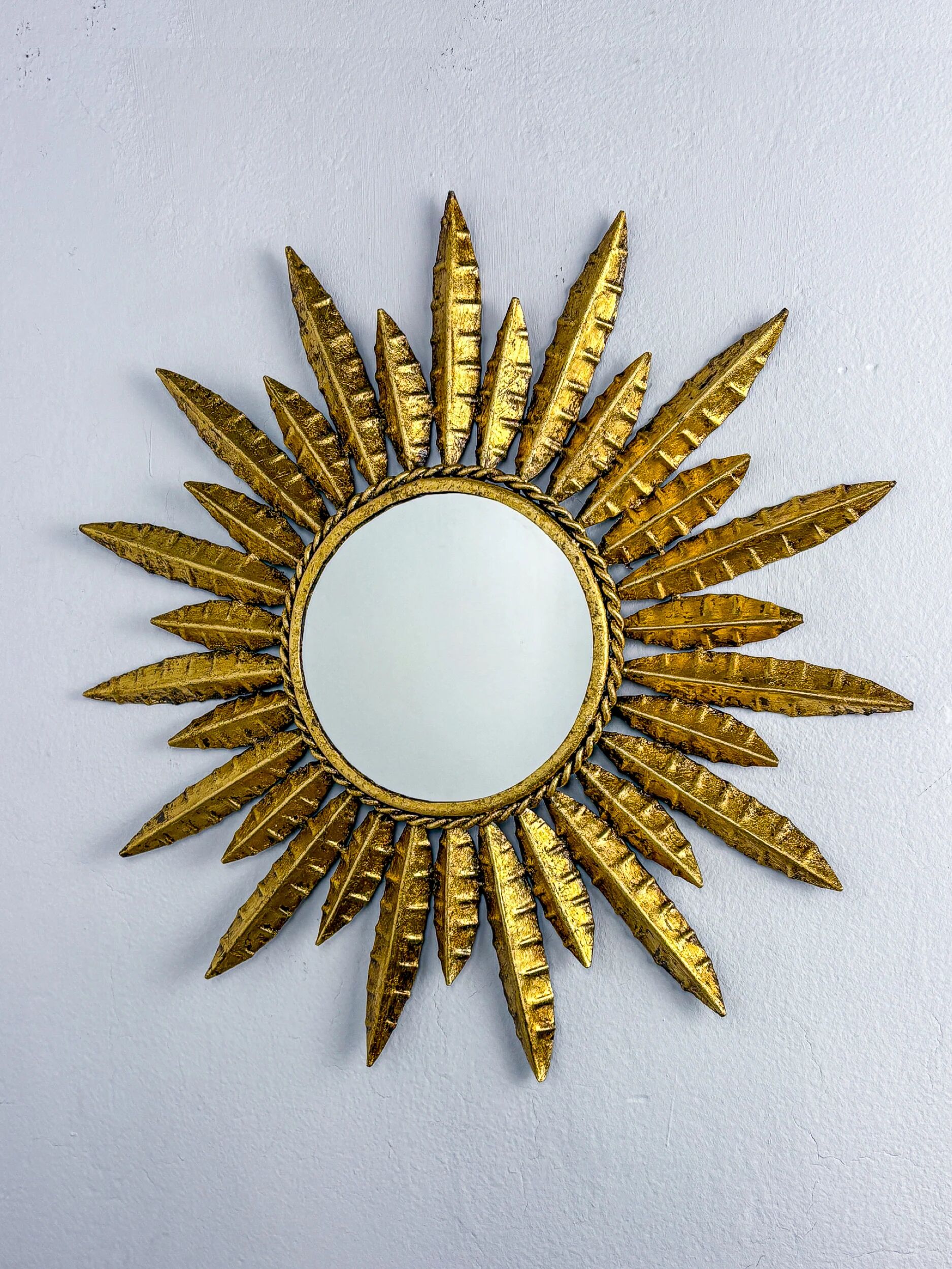 Midcentury modern sunburst wall mirror – gilt metal, France 1960s
