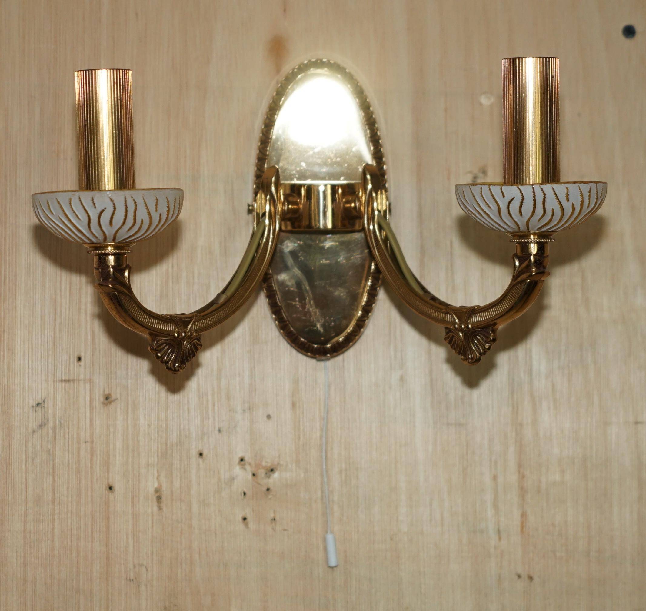 Reccagni wall light pair in brass and frosted glass.