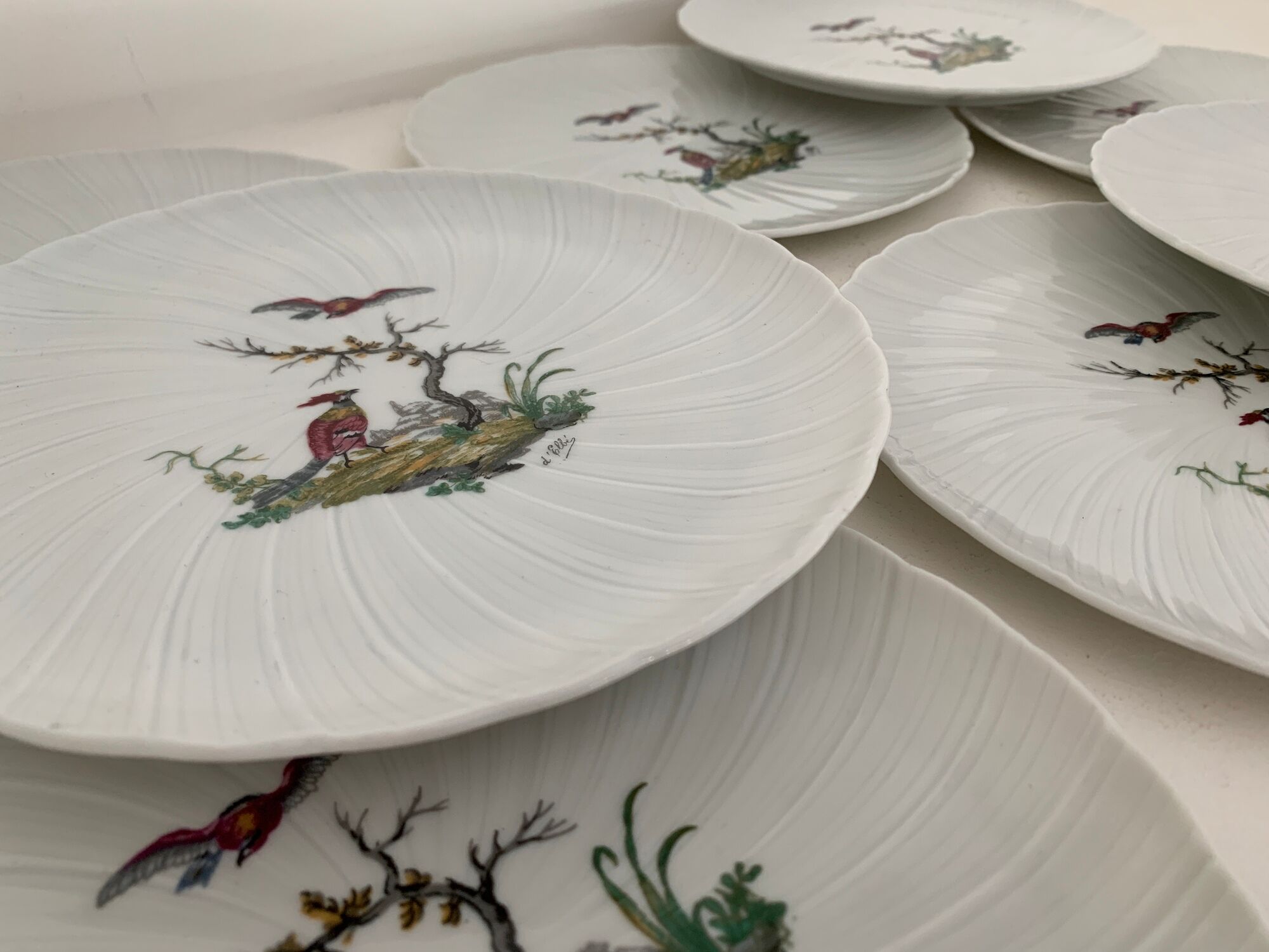 8 Bernardaud and Co. dessert plates signed Elbé, Limoges porcelain, decorated with birds