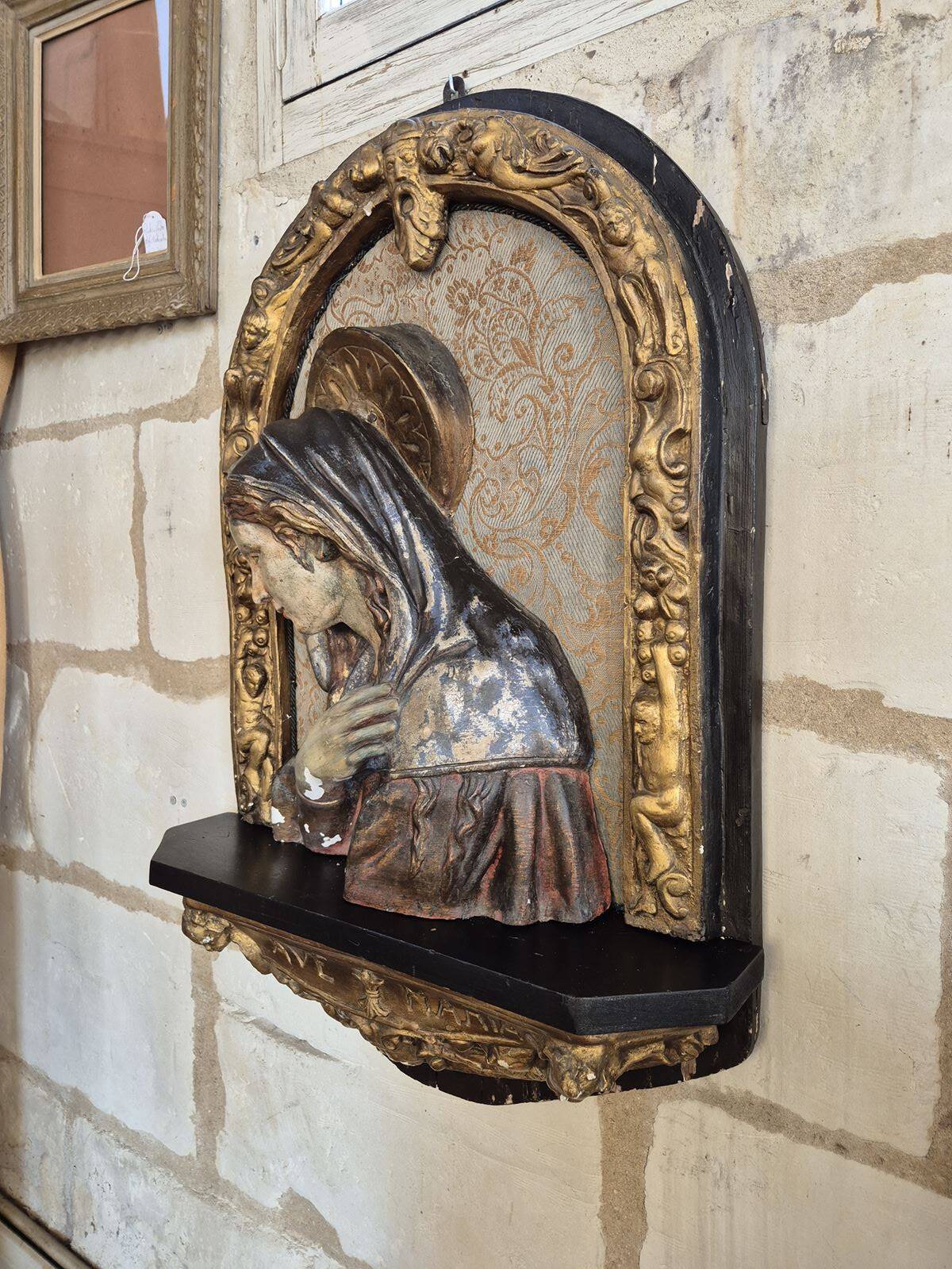 Ancient bas-relief in wood and stucco