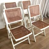 4 folding chairs with wicker seating
