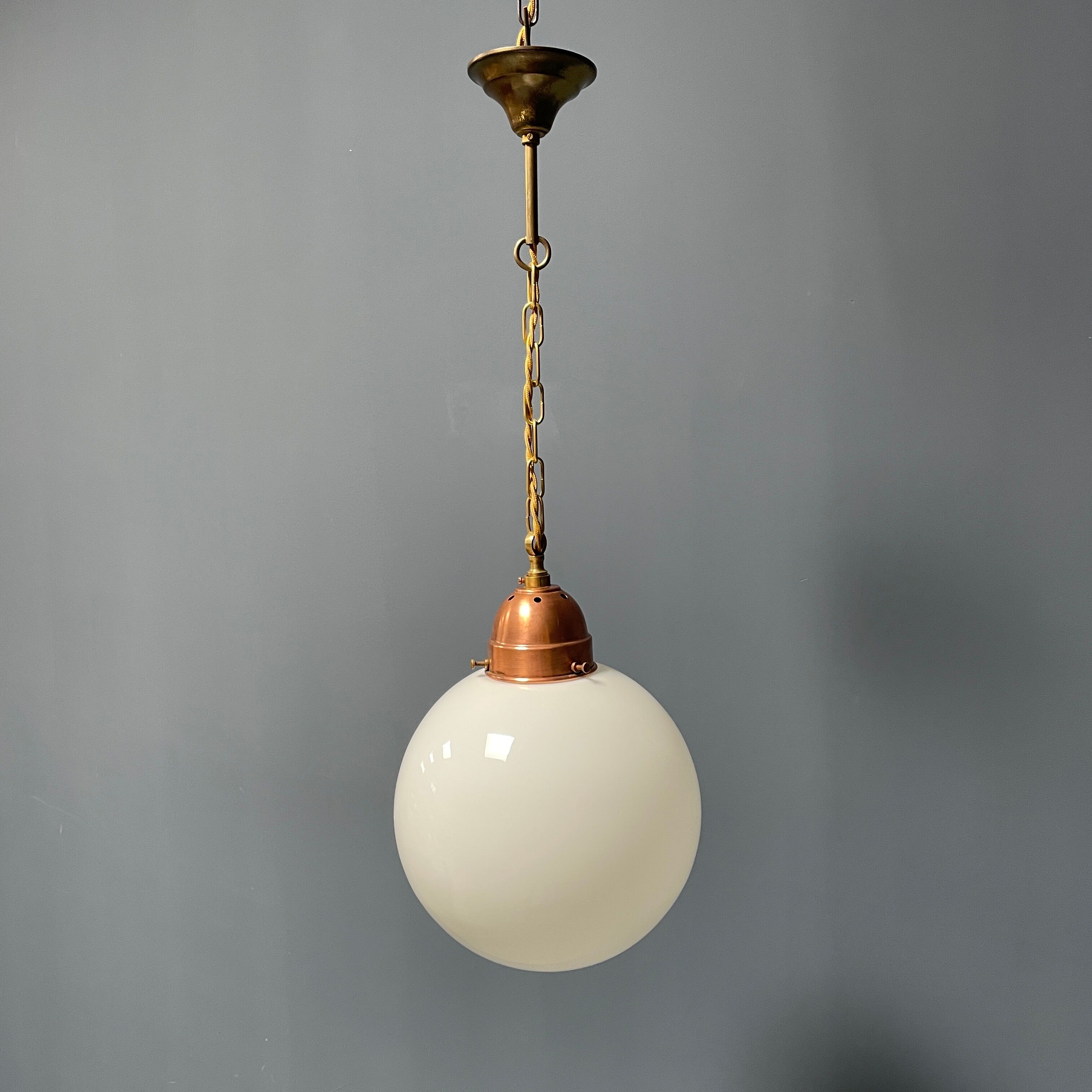 Opaline glass ball hanging lamp with copper fixture