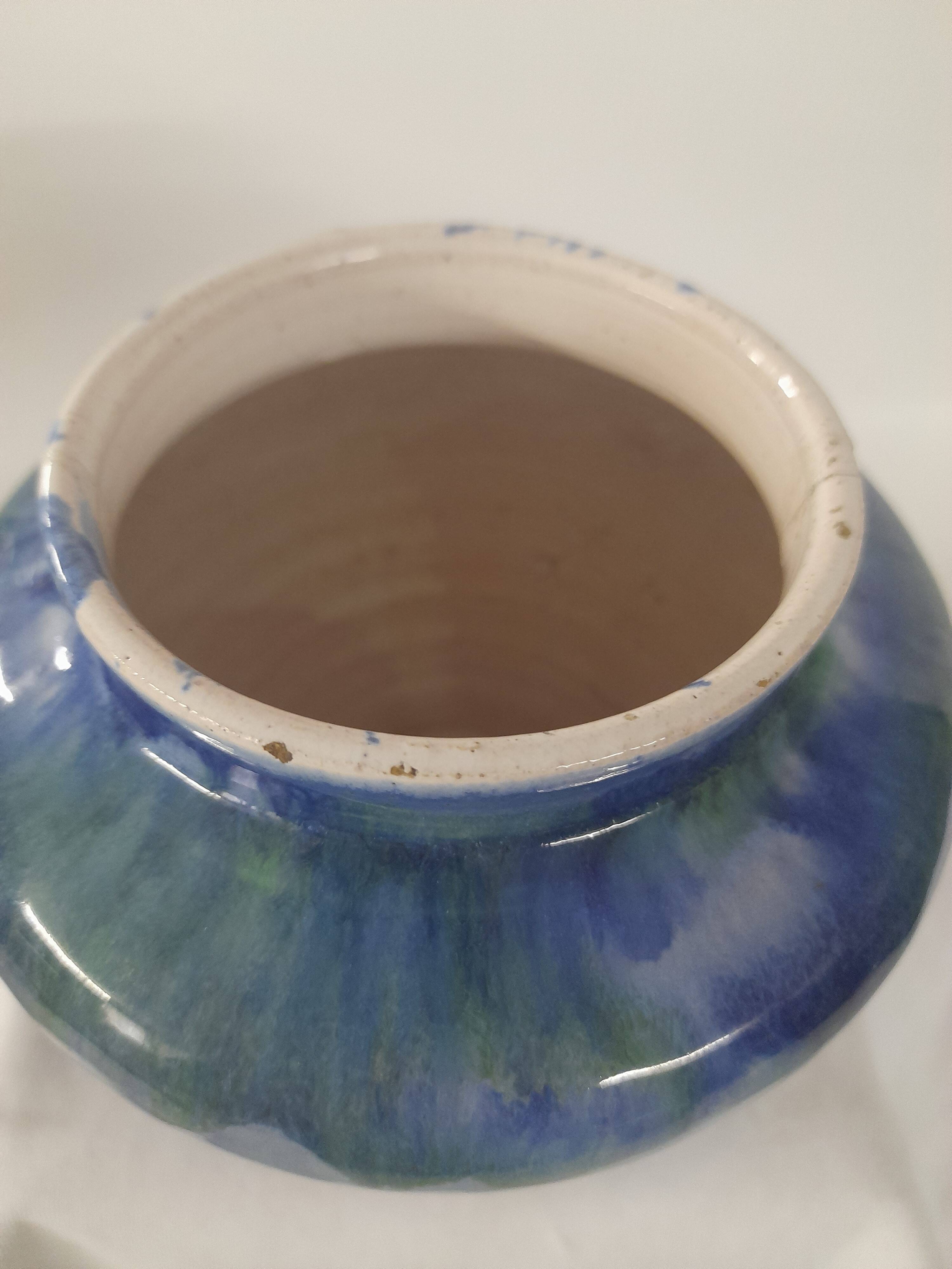 a blue flamed stoneware vase