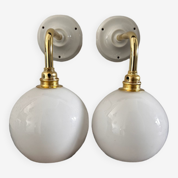 Pair of globe wall lights in white opaline