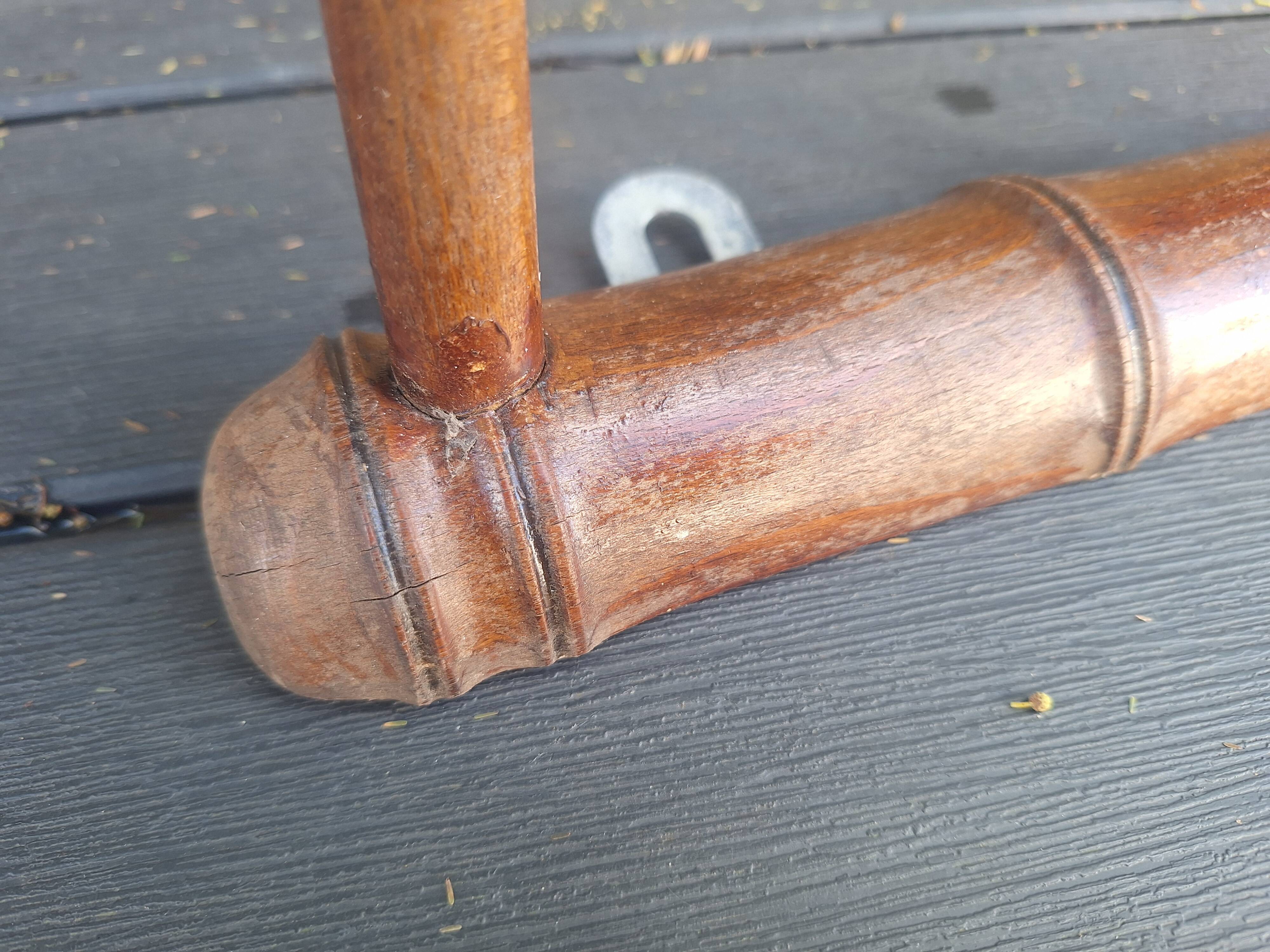 Old wooden coat hook imitating bamboo.