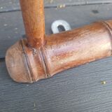 Old wooden coat hook imitating bamboo.