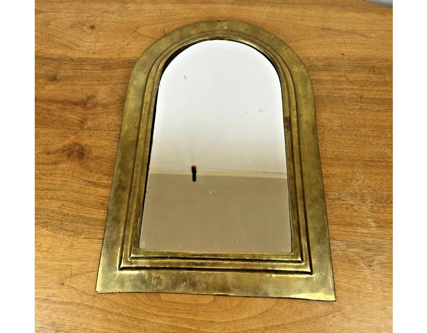 Vintage golden half-moon mirror