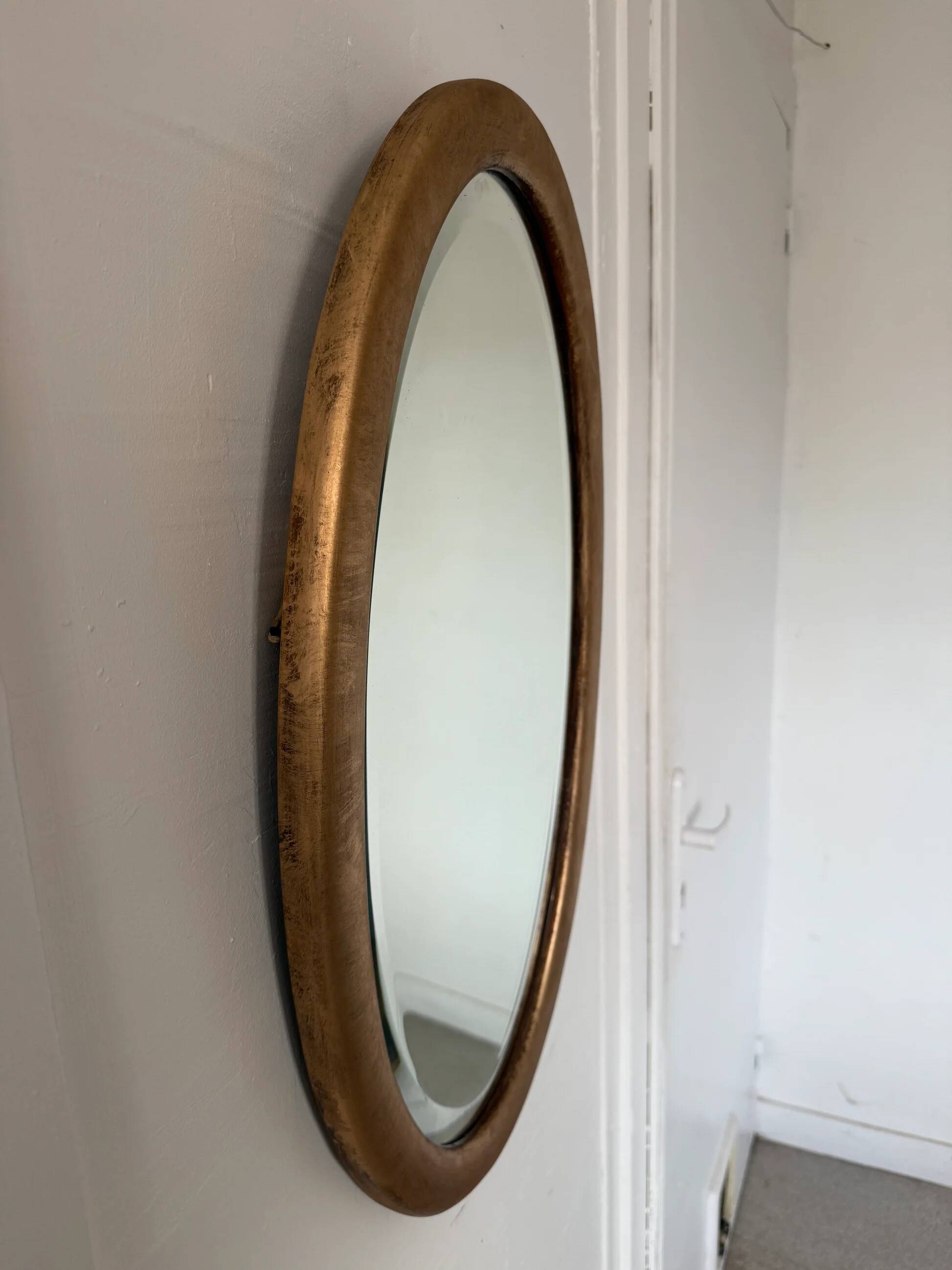 Miroir doré ovale ancien glace biseautée