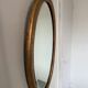 Miroir doré ovale ancien glace biseautée