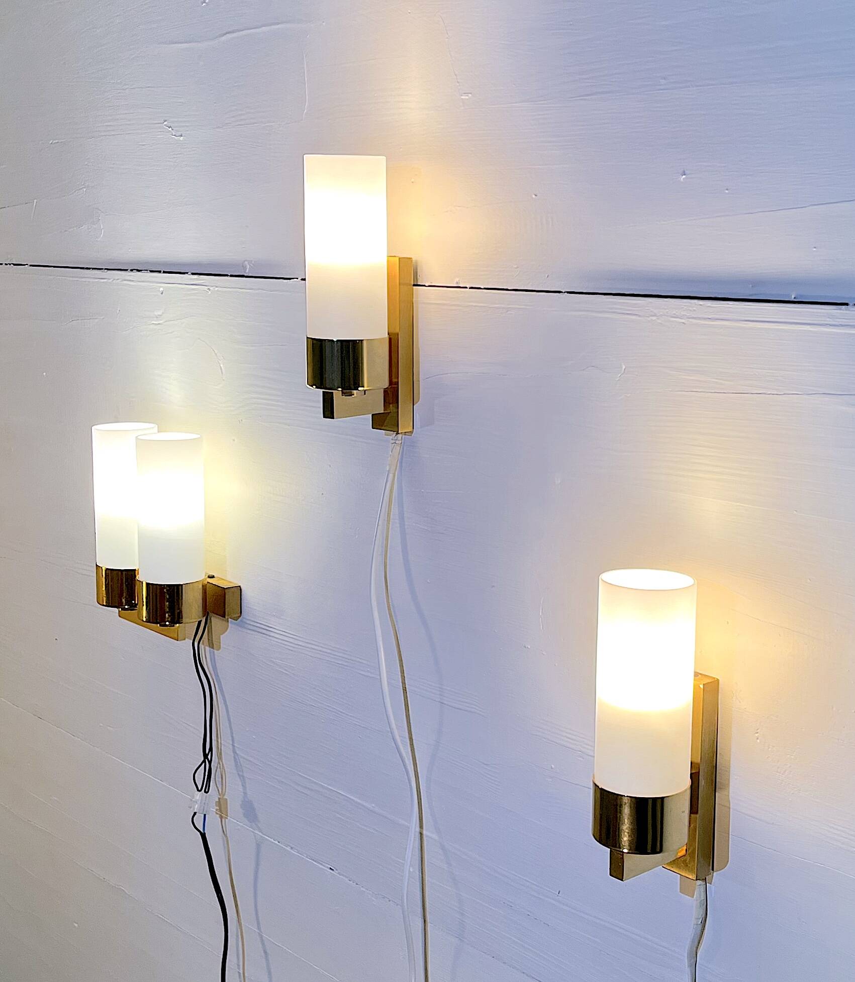 Set of three brass and opaline sconces, mid-century France