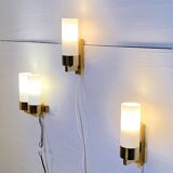 Set of three brass and opaline sconces, mid-century France