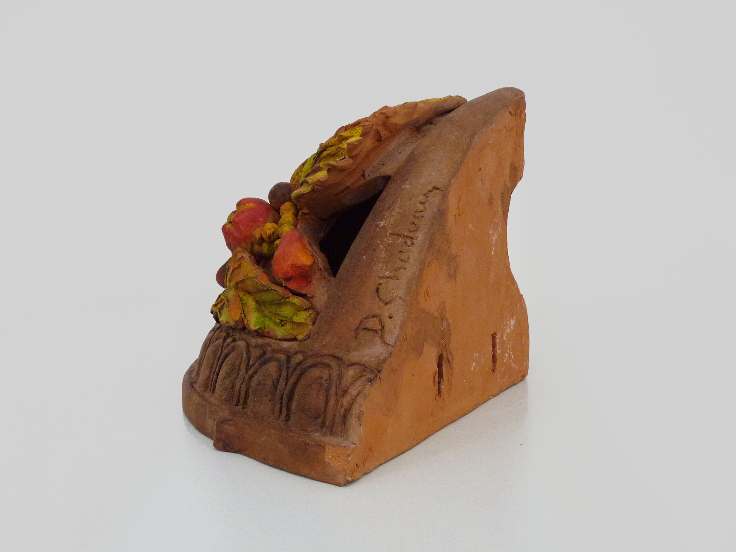 Corner wall lamp in terracotta with fruit decoration, signed D.Chadeau