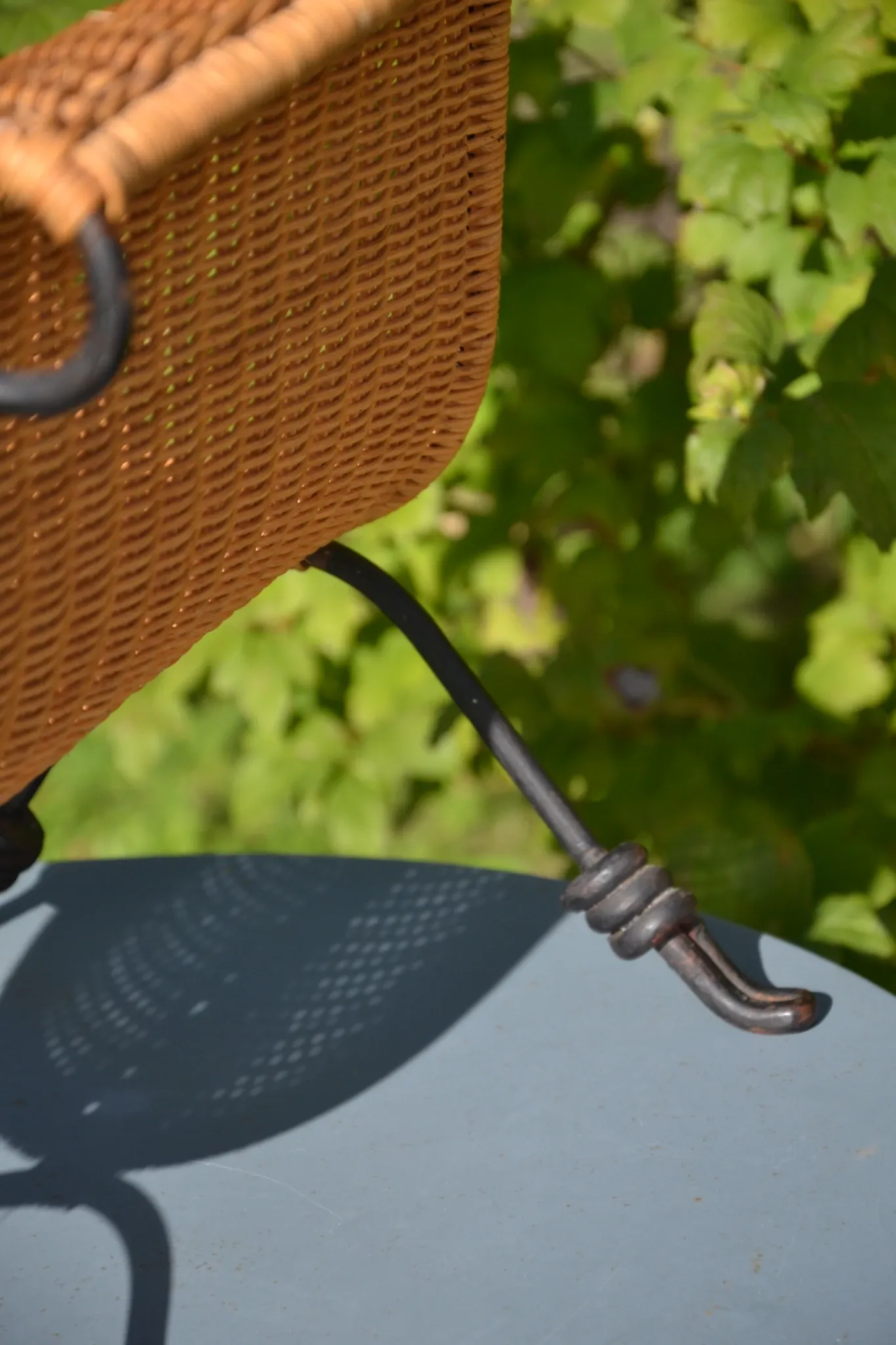 Wrought iron and rattan magazine/newspaper rack