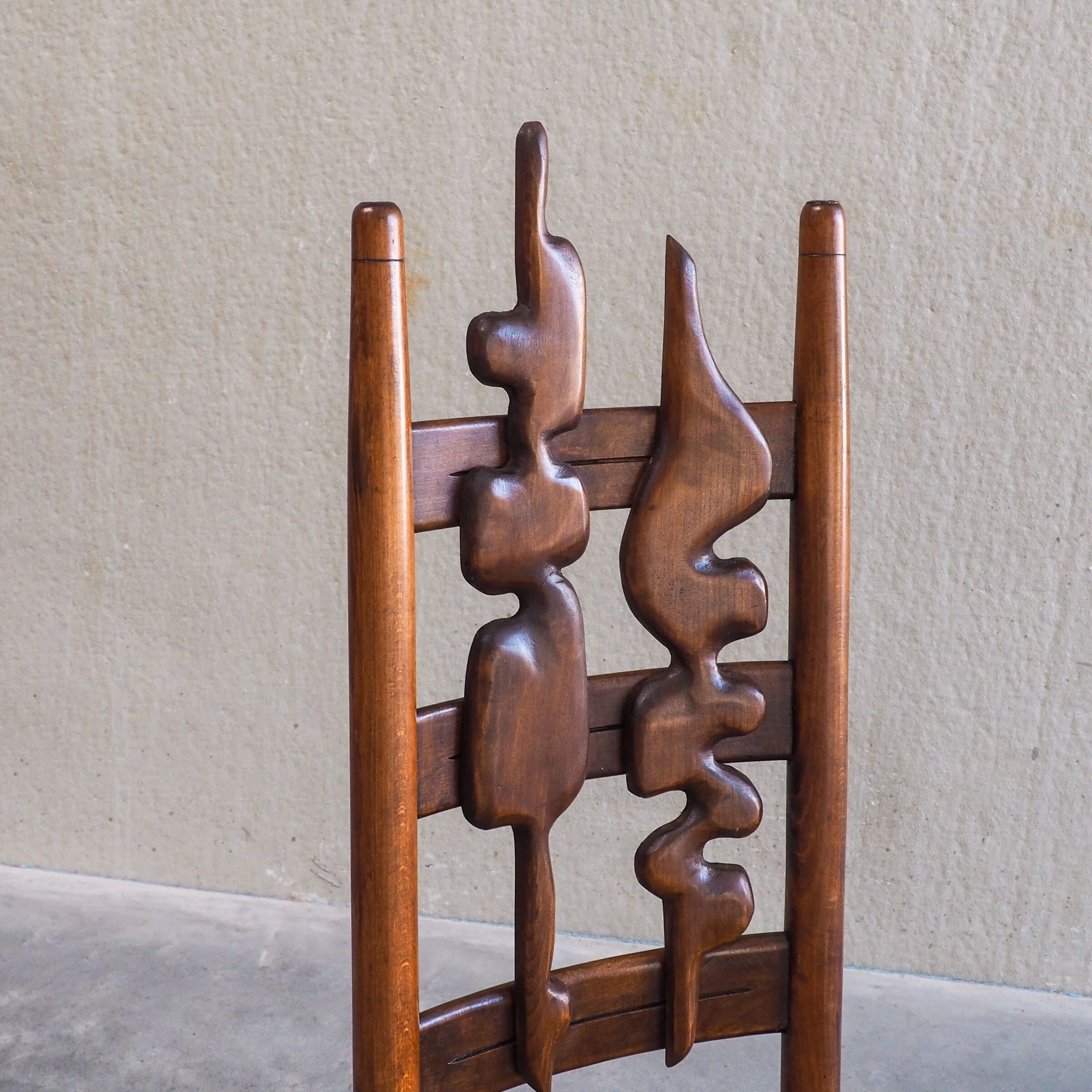 2 sculptural brutalist high-back chairs