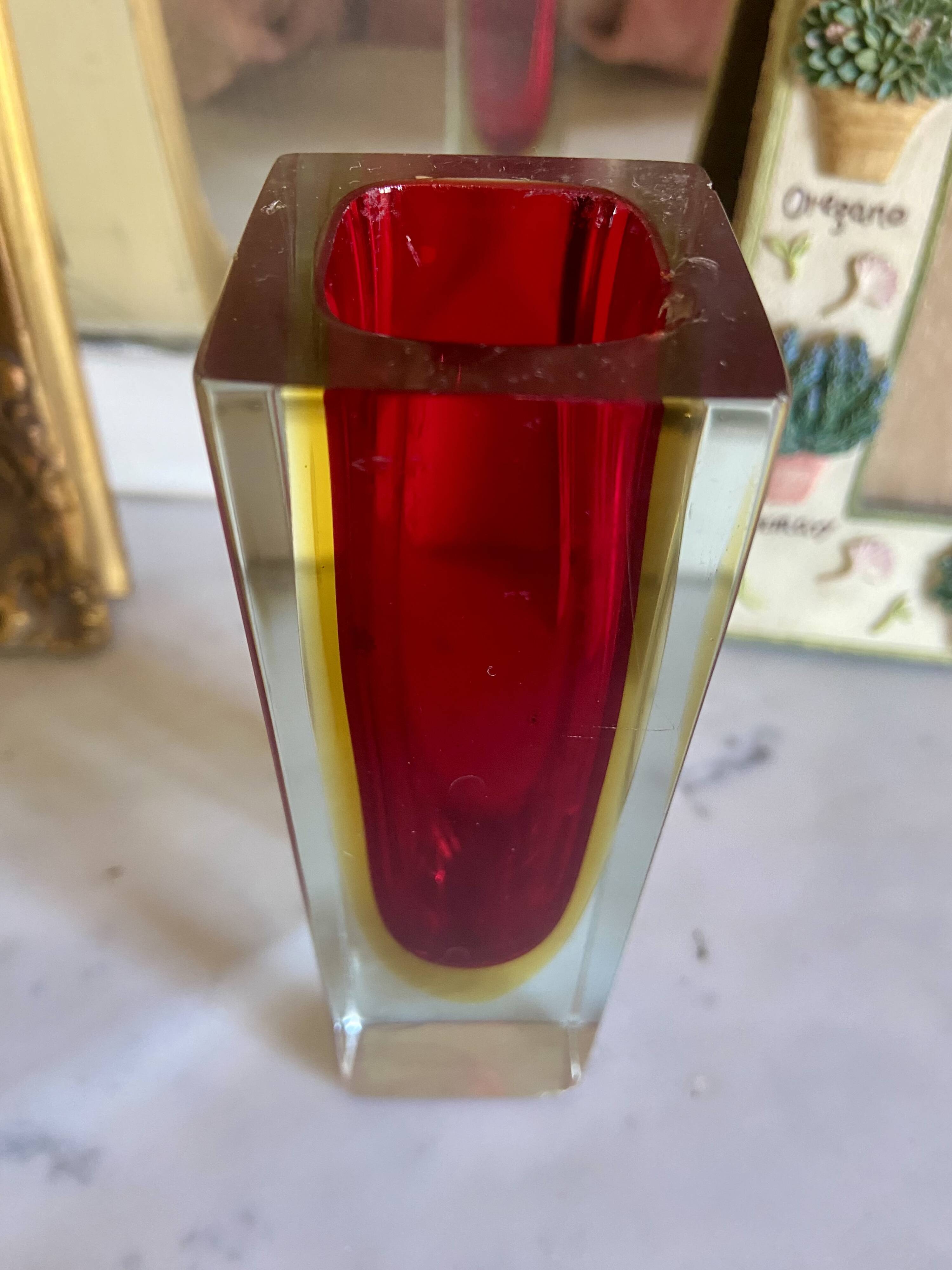 Small red vase made of Murano glass.