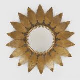 Old sun mirror with foliage in gilded metal with twisted frieze from the 60s