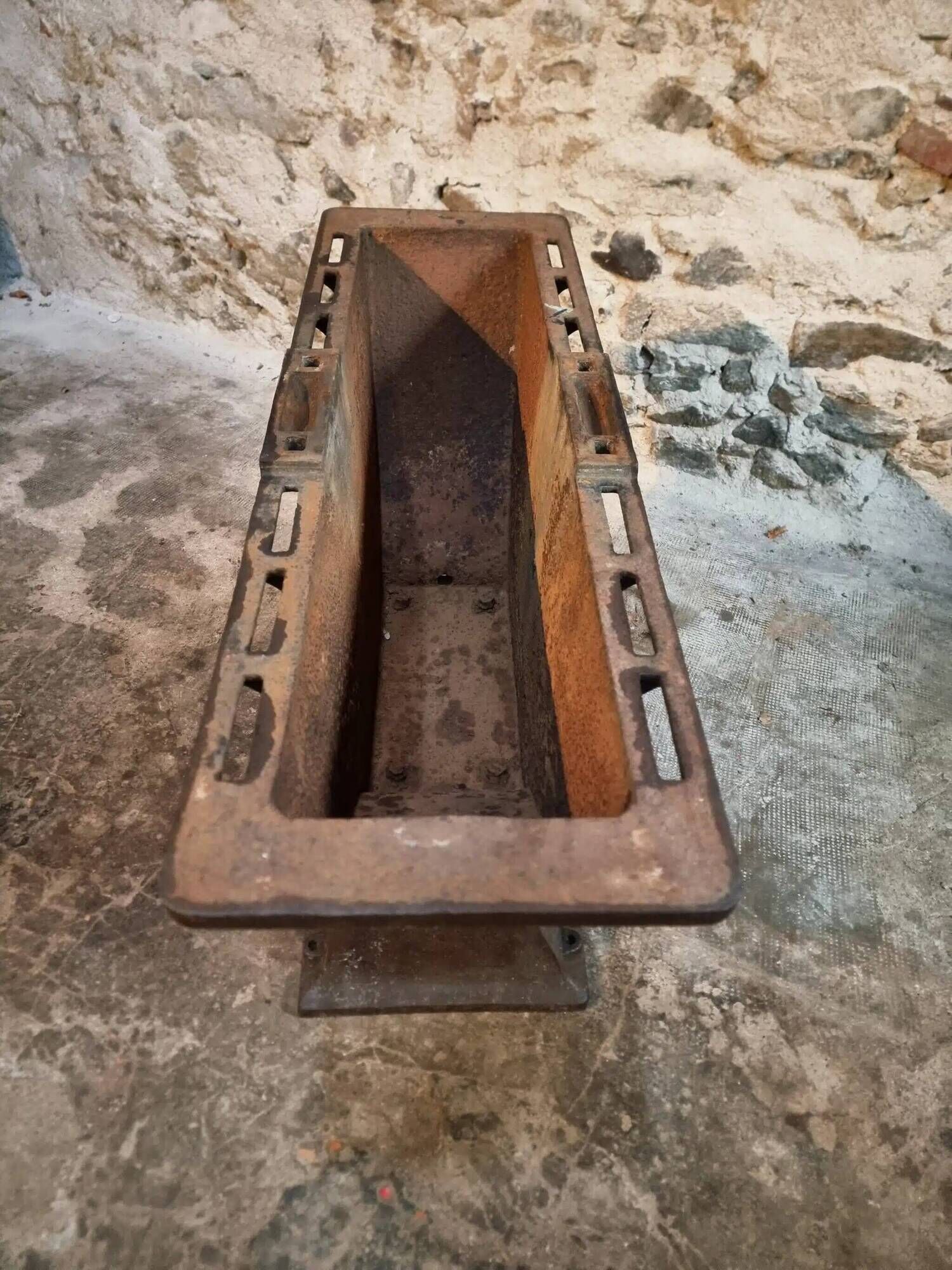 Old French industrial table with a cast iron base and a pine top.