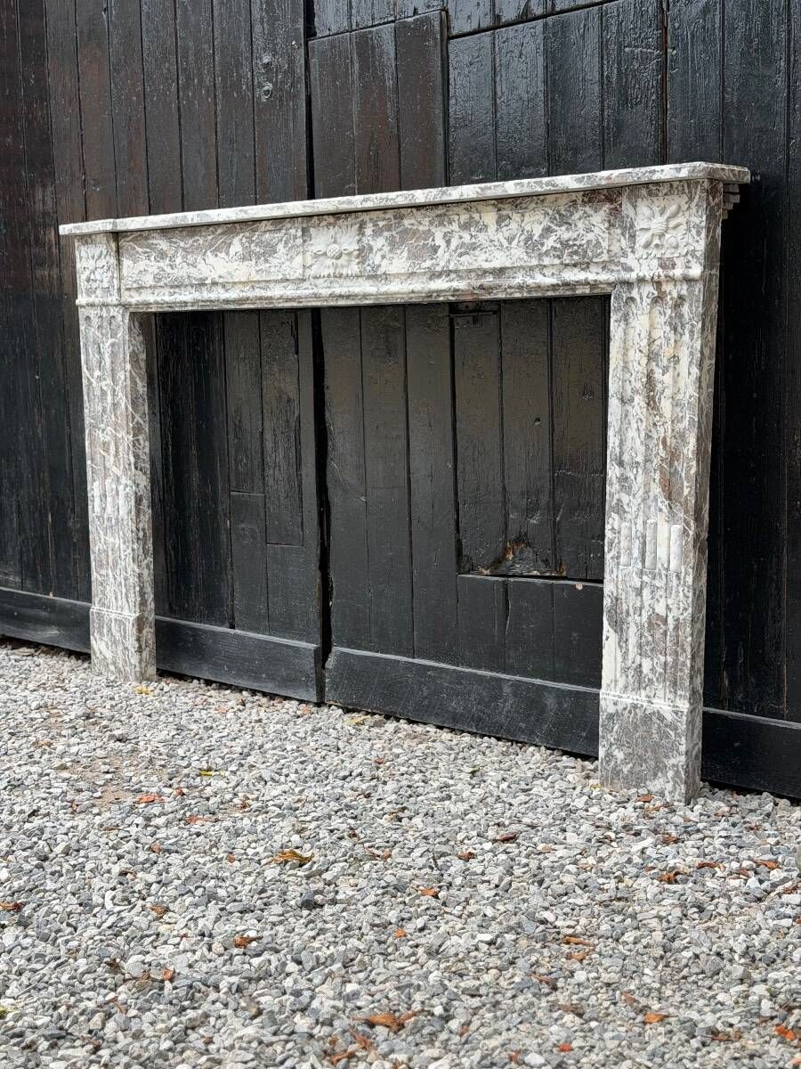 Louis XVI fireplace in grey Ardennes marble, late 18th century.