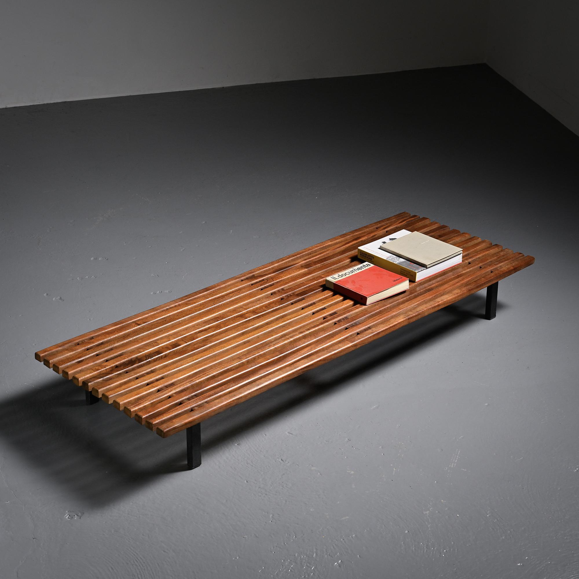 Cansado bench in mahogany by Charlotte Perriand, circa 1962.