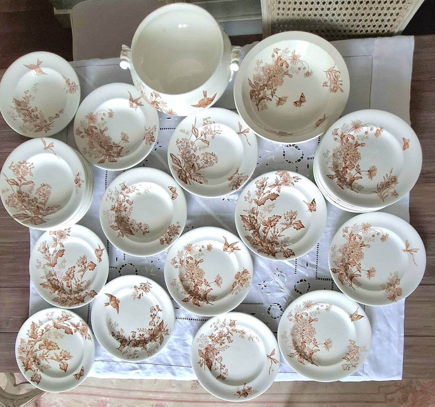 Antique iron earthenware plates accompanied by dishes